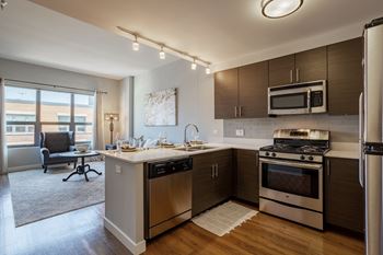 a kitchen with stainless steel appliances and a counter top